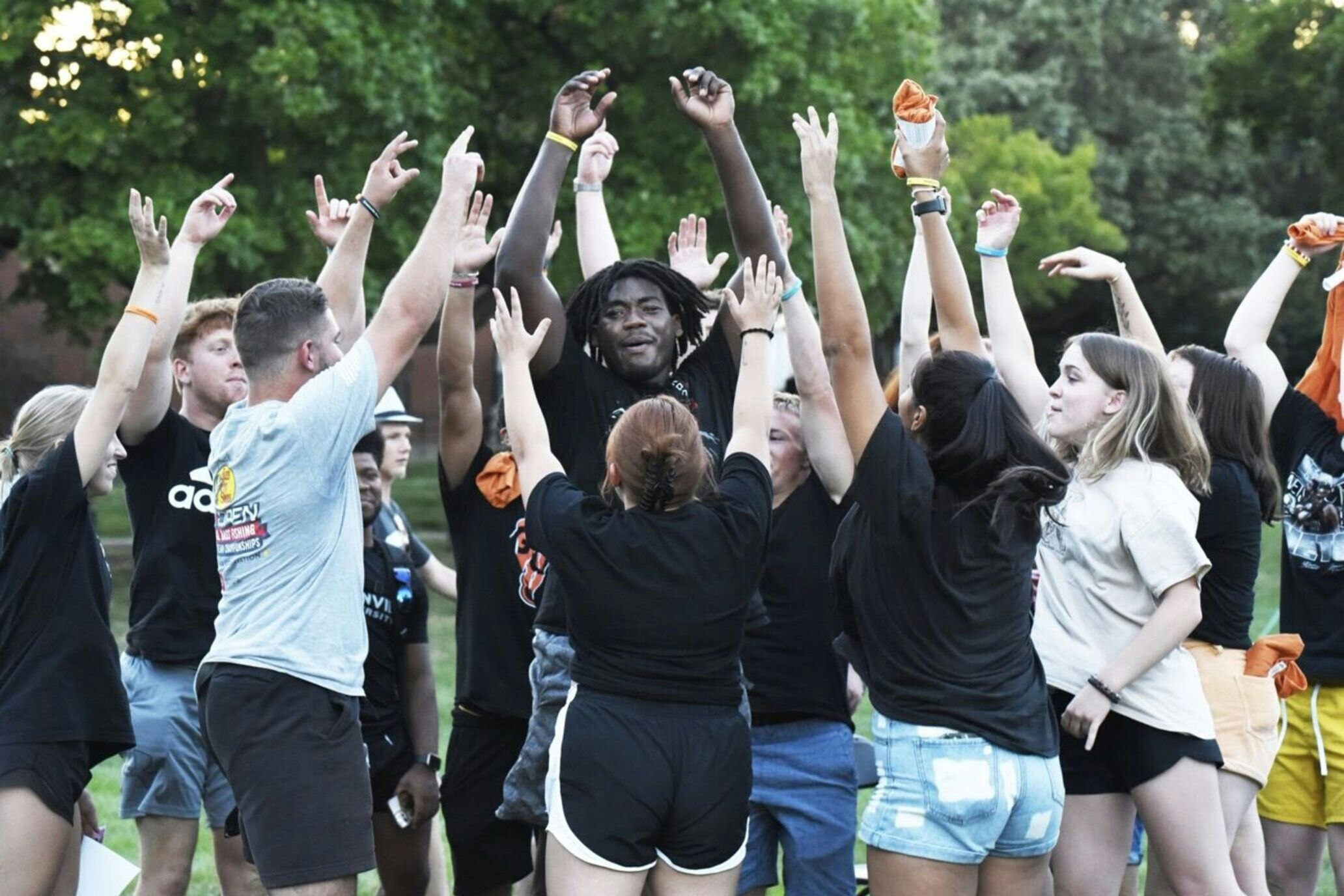 Students raising hands at Greenville University